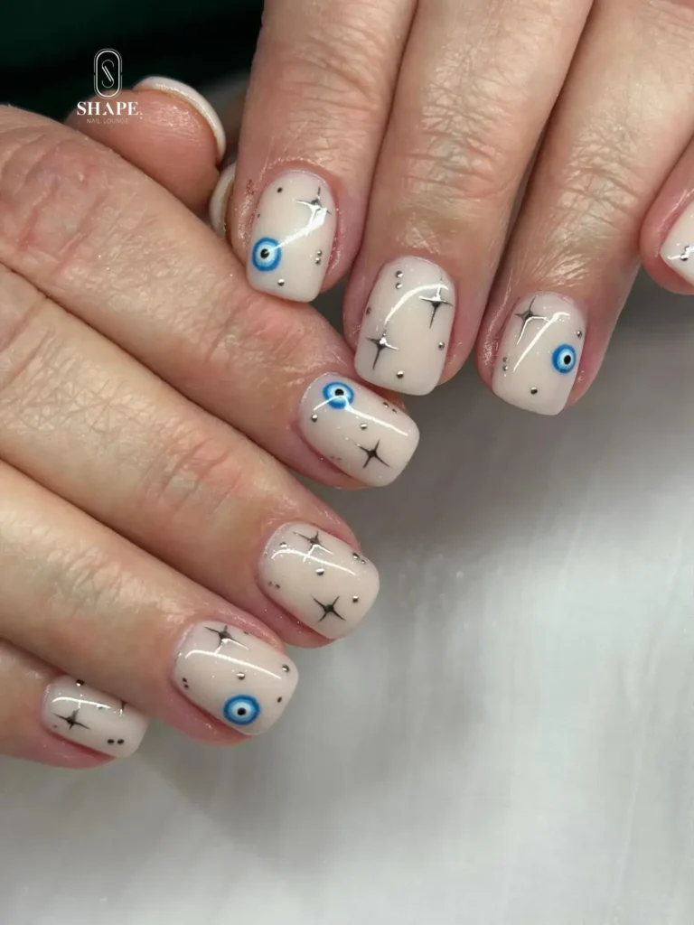 nude with evil eye short nails designs