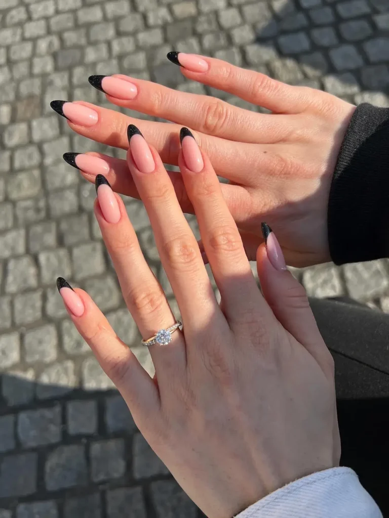 sheer nude or pink with black french tip nails