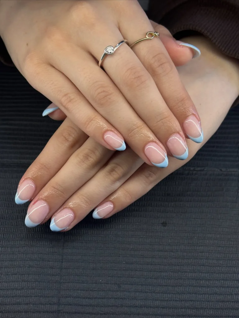 classic baby blue french tip nails on a nude base