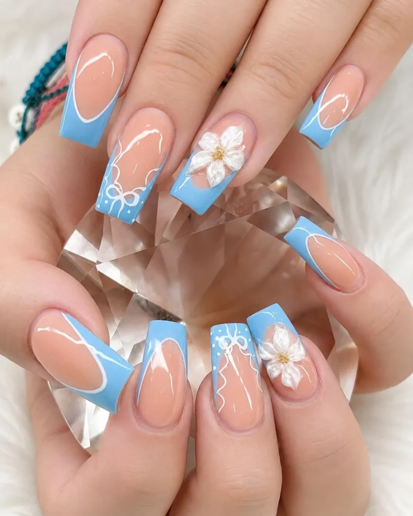 floral accents blue finish french tip nails