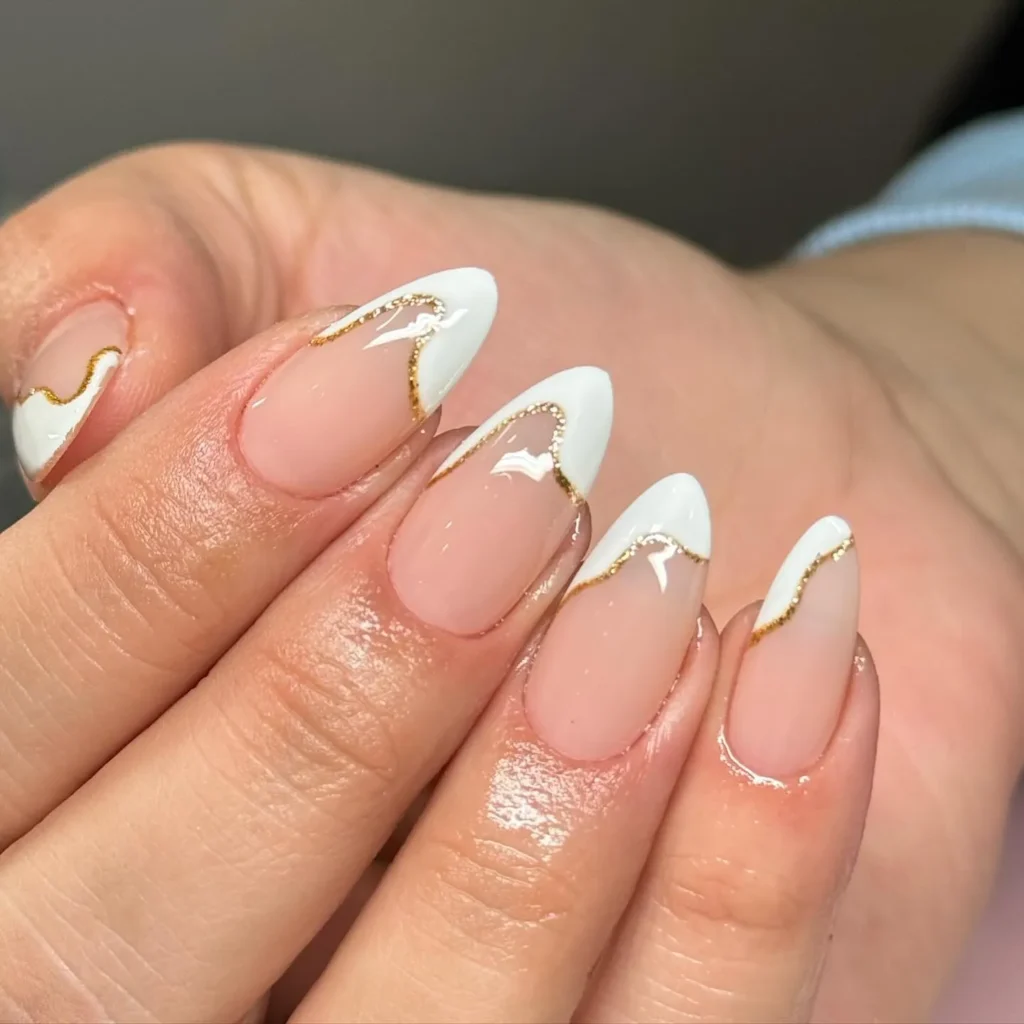 gold-outlined white french tip nail designs with elegant metallic detailing
