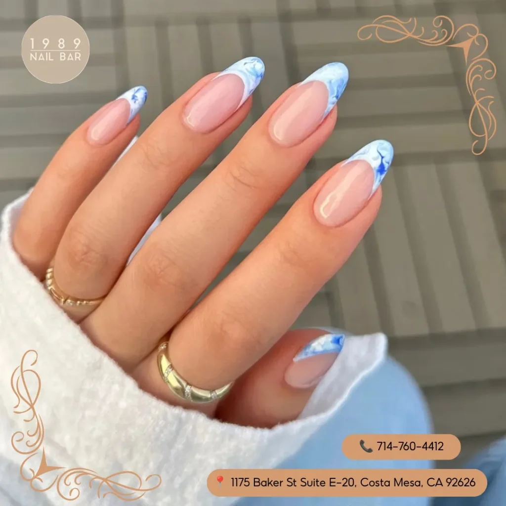 light blue with marble or chrome accents french tip nails