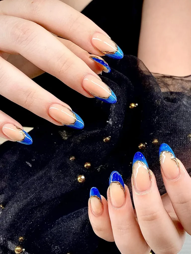 royal blue with gold accent line french tip nails