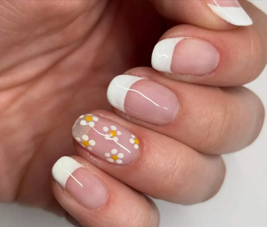 white french tip nail designs with daisy accent