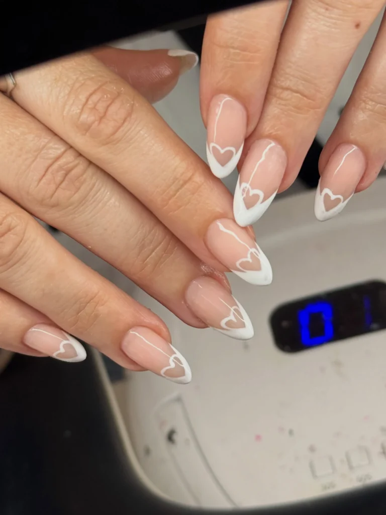 white french tip nail designs with heart accent