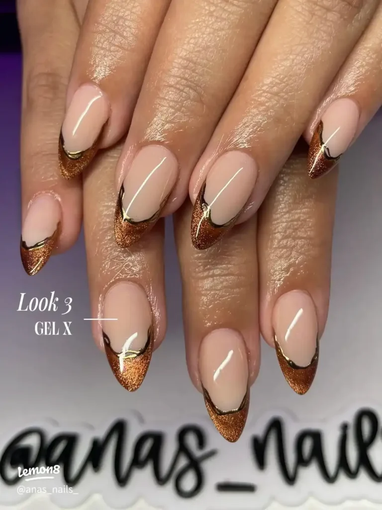 Chrome French Tip Nails 2026: 32 Designs and What to Tell Your Nail Tech 13 bronze chrome french tips on short almond nails with a caramel base