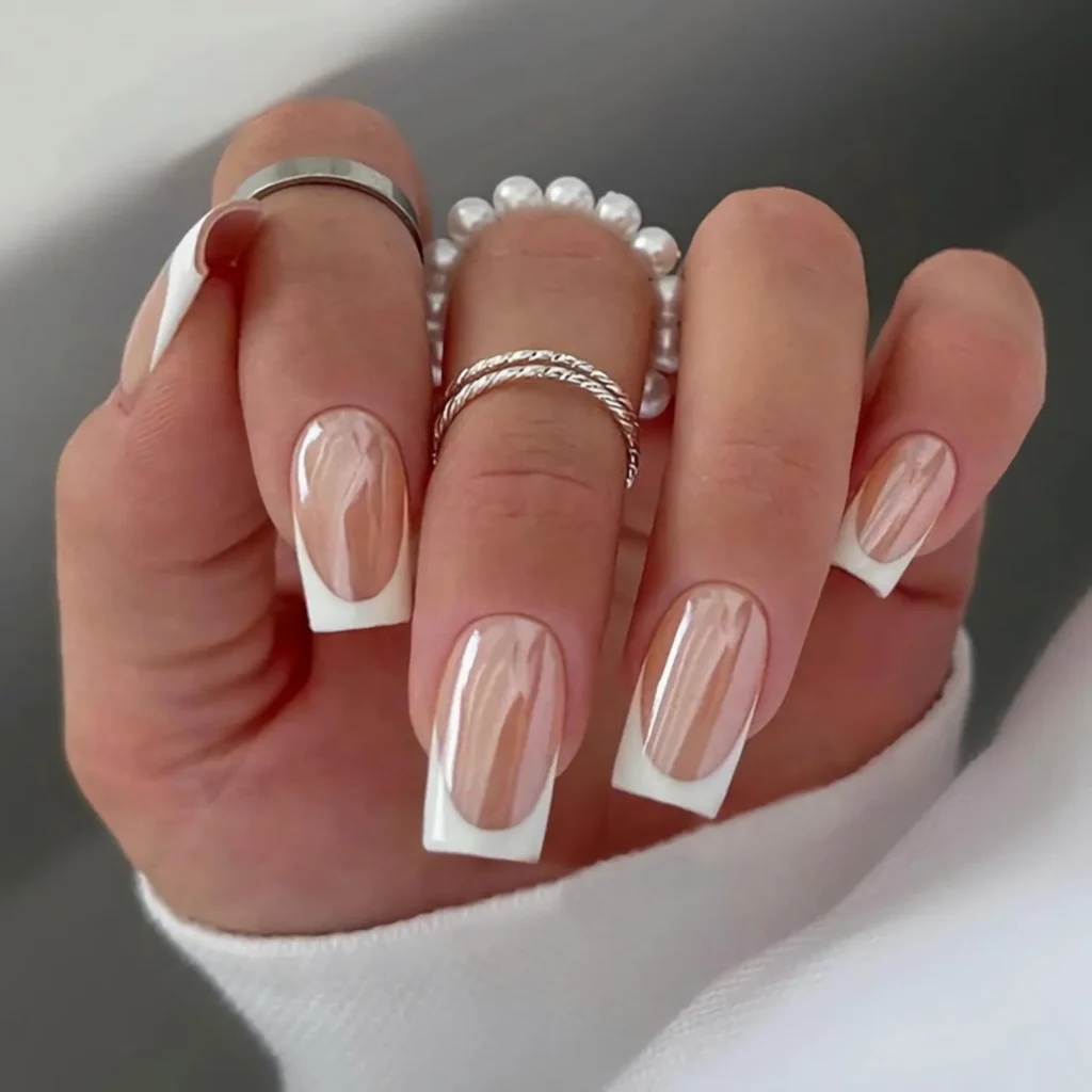 Chrome French Tip Nails 2026: 32 Designs and What to Tell Your Nail Tech 10 classic white french tips covered with pearl chrome powder on square nails