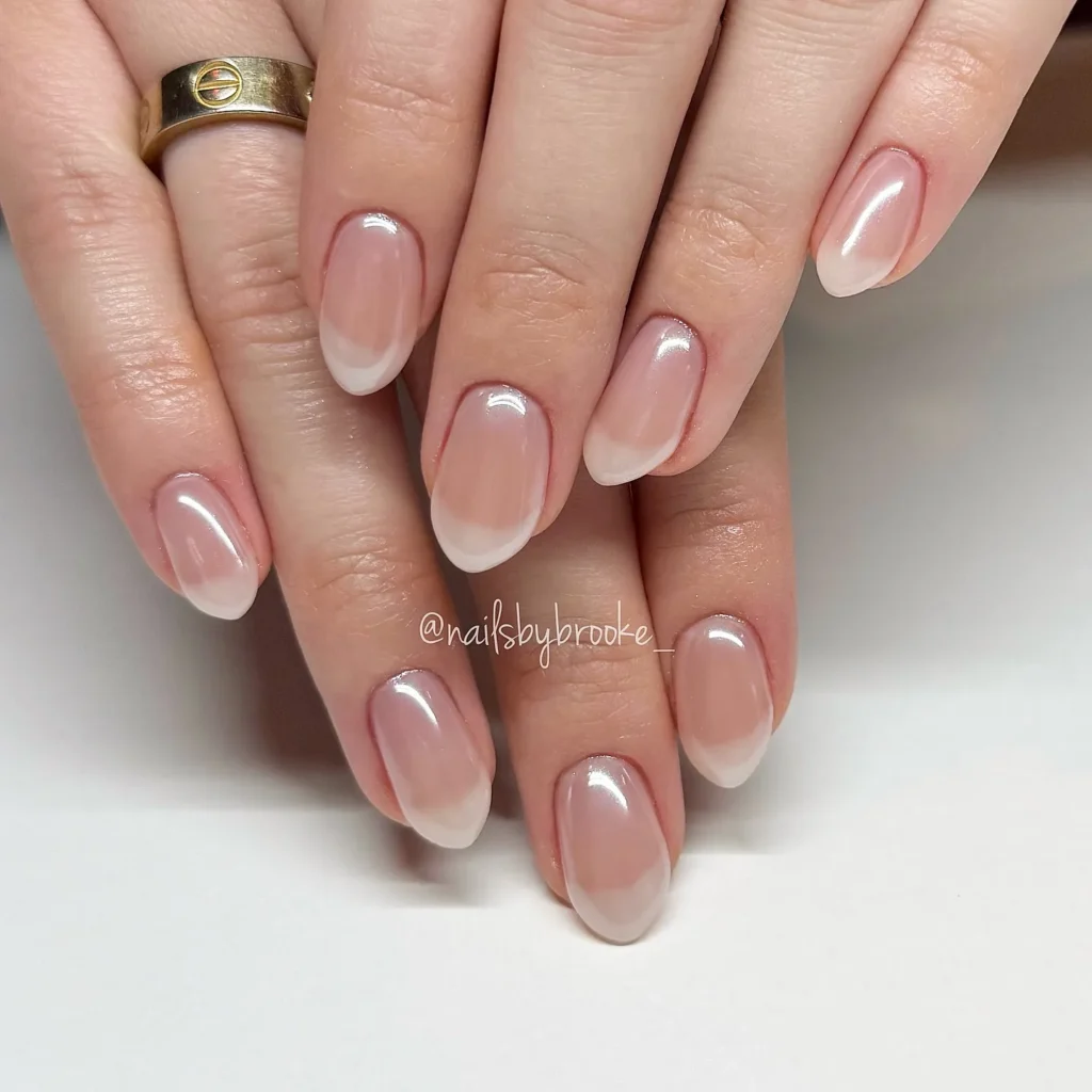 Chrome French Tip Nails 2026: 32 Designs and What to Tell Your Nail Tech 7 pearl chrome french tips on almond nails with a milky white base