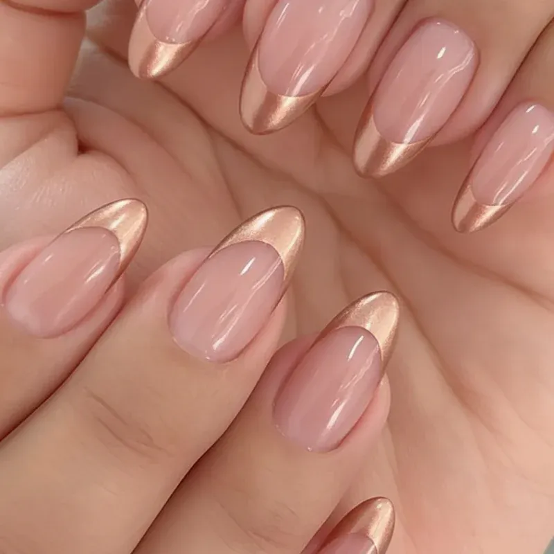 Chrome French Tip Nails 2026: 32 Designs and What to Tell Your Nail Tech 12 rose gold chrome french tips on oval nails with a blush pink base